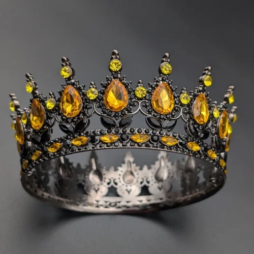 Корона чорна з жовтим камінням.